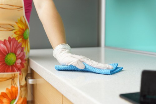 Carpet cleaning team applying health and safety controls during a service visit