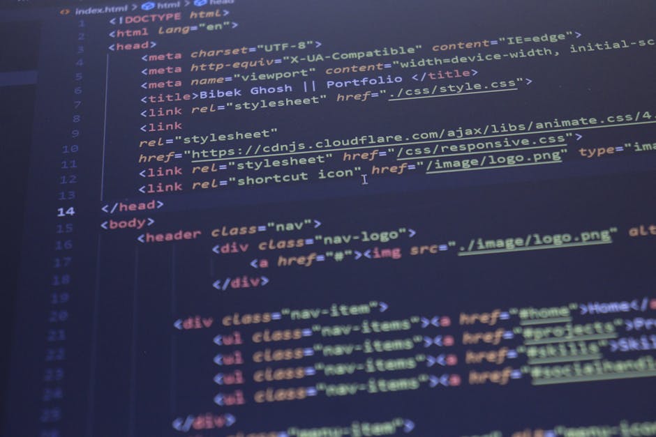 Photograph of a computer screen displaying HTML code in a code editor. The code features HTML tags such as <html>, <head>, <title>, and <body>, with visible syntax highlighting showing various colors